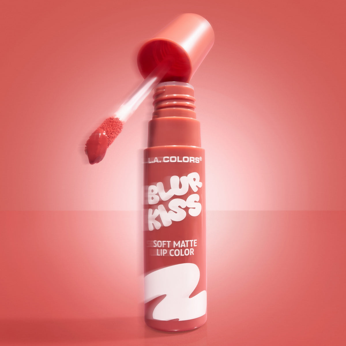 Thumbnail: L.A. Colors Blur Kiss Soft Matte Lip Color in Just Pinky, open tube and applicator on a pink background.