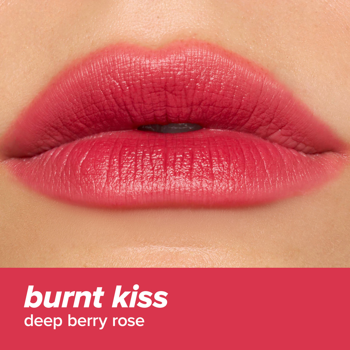 Close-up of lips wearing L.A. Colors Blur Kiss Soft Matte Lip Color in Burnt Kiss. Text: burnt kiss, deep berry rose.