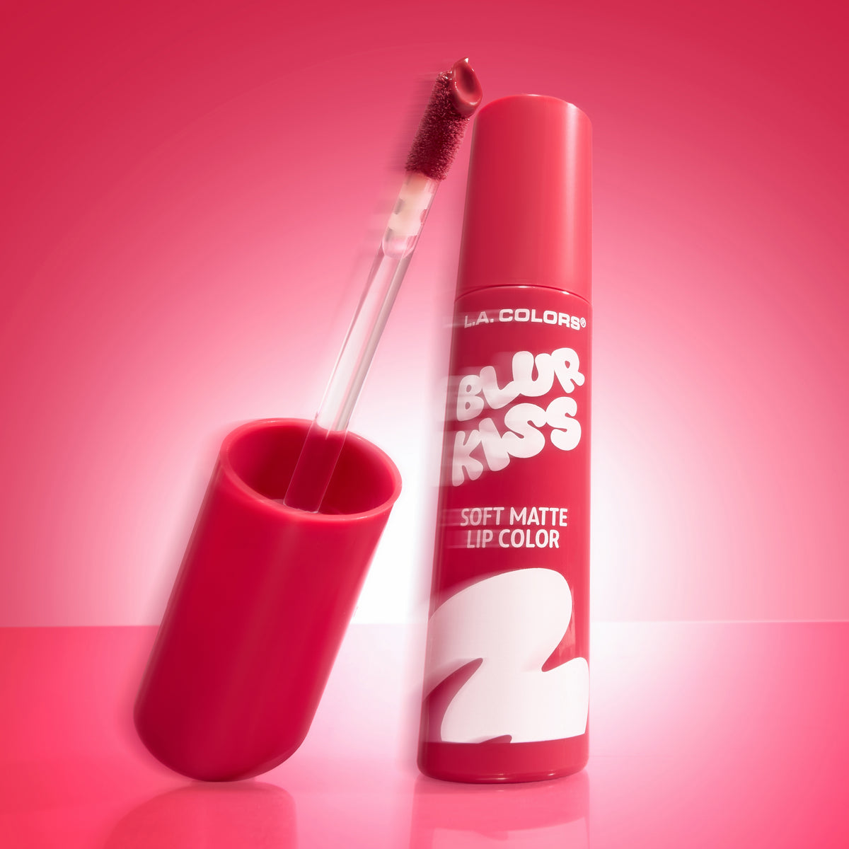 Thumbnail: L.A. Colors Blur Kiss Soft Matte Lip Color in Burnt Kiss, open tube and applicator on a pink background.