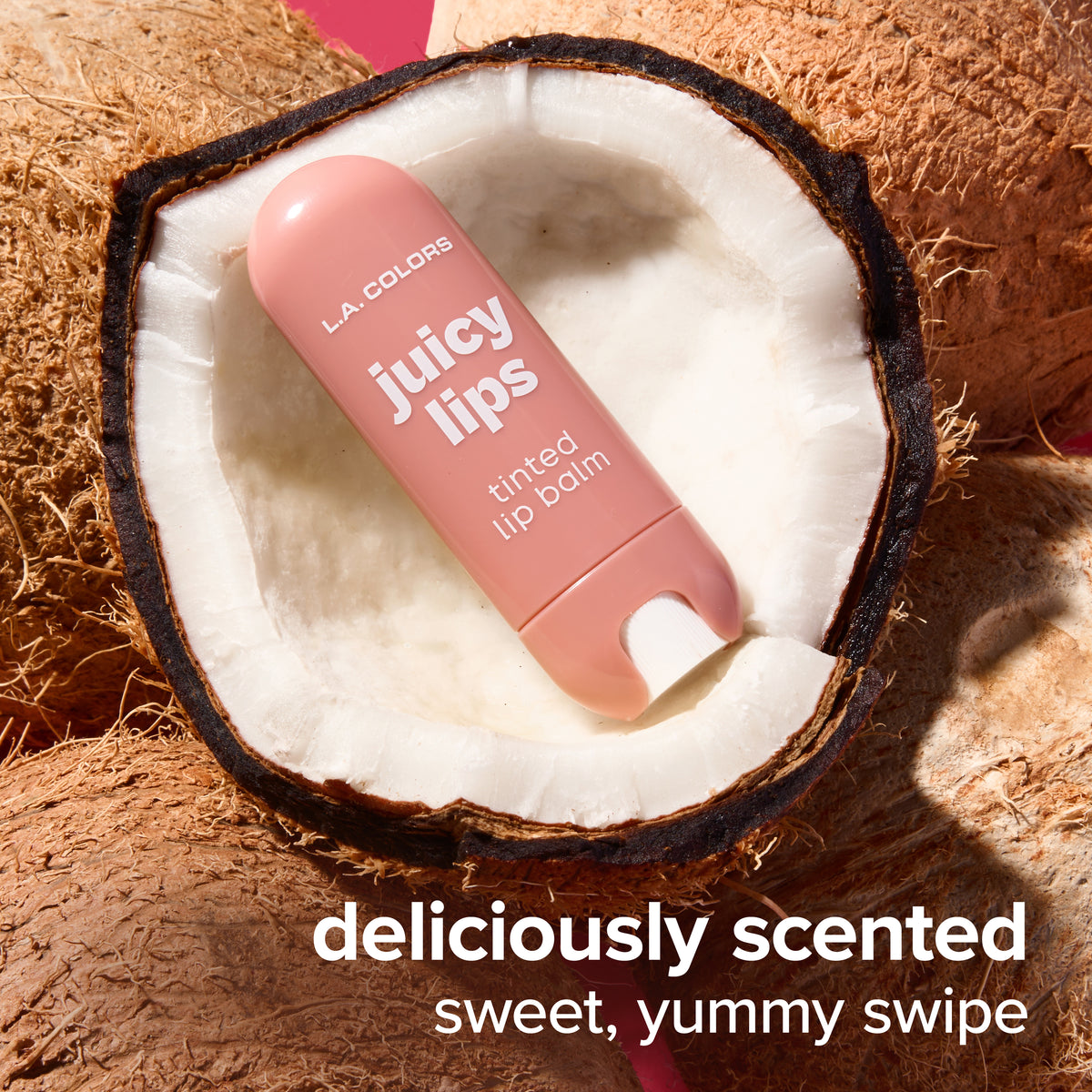 Thumbnail: Juicy Lips Tinted Lip Balm in Butter Kiss nestled in fresh coconut