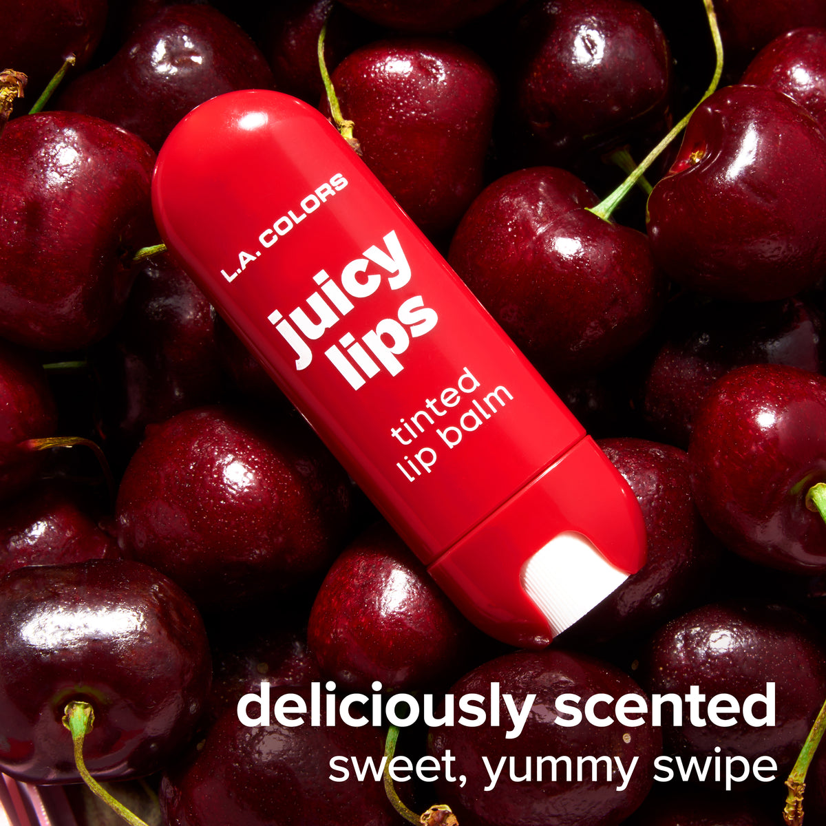 Thumbnail: Juicy Lips Tinted Lip Balm in Berry Crush surrounded by dark cherries