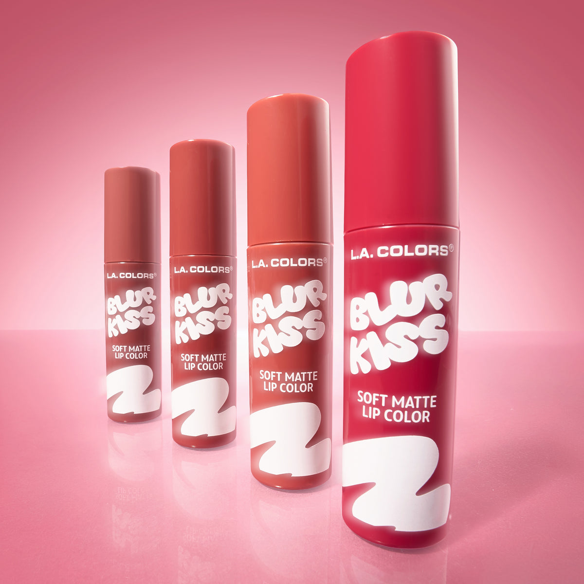 All four shades of L.A. Colors Blur Kiss Soft Matte Lip Color standing in a row on a pink background.
