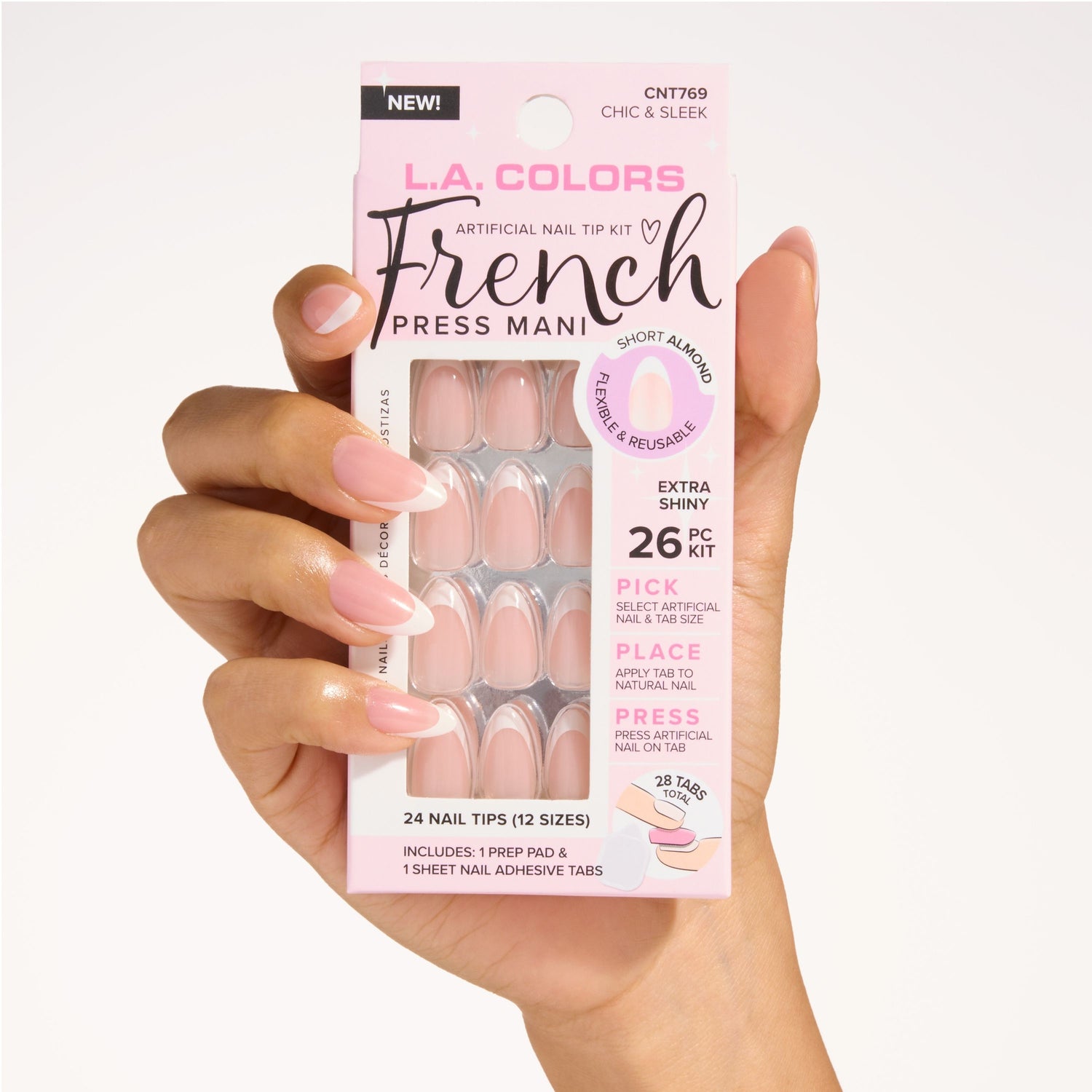 Hand holding the French Press Mani Chic & Sleek nail tip kit.